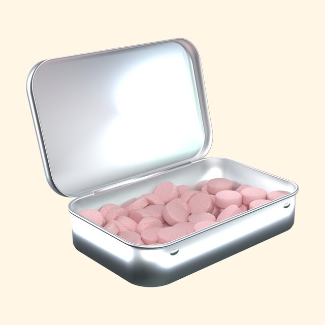 Strawberry caffeinated mints in an open tin